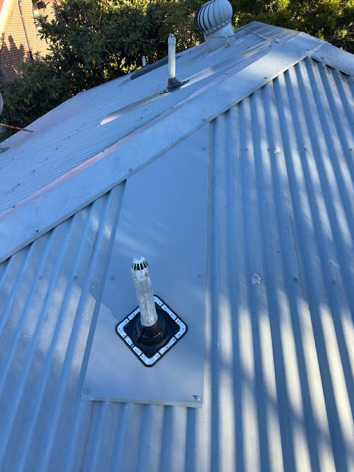 Metal roof flashing and wall junction installation Sydney