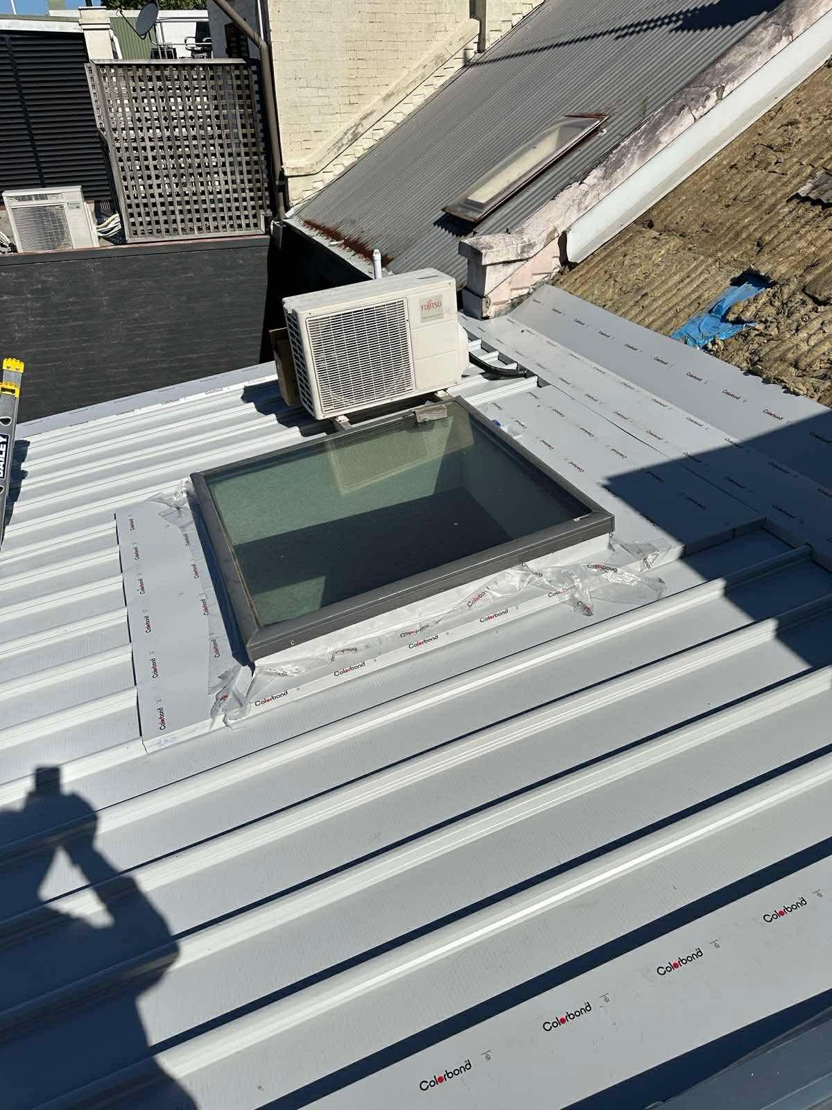 Roof vent pipe flashing on corrugated metal roof
